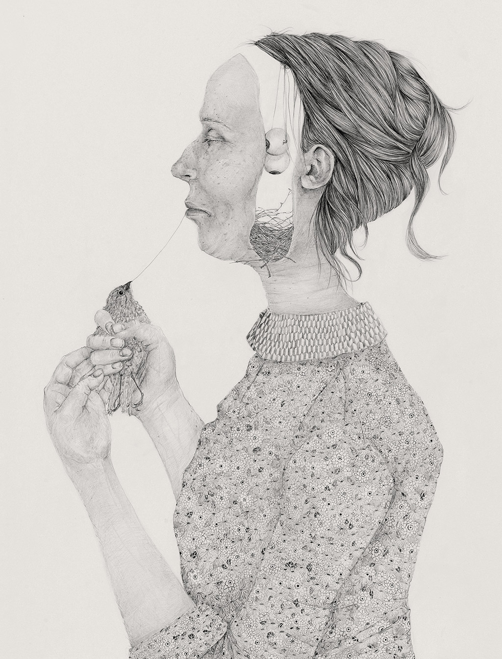 woman with a bird nest in her head holding a bird